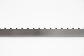 Multiple band saw blades displayed in a grouping, on a white backdrop with a dark background. 1.5" wide, 1" tooth spacing, with a 7 degree hook angle. Big Mouth Blades is the supplier for these portable sawmill blades.