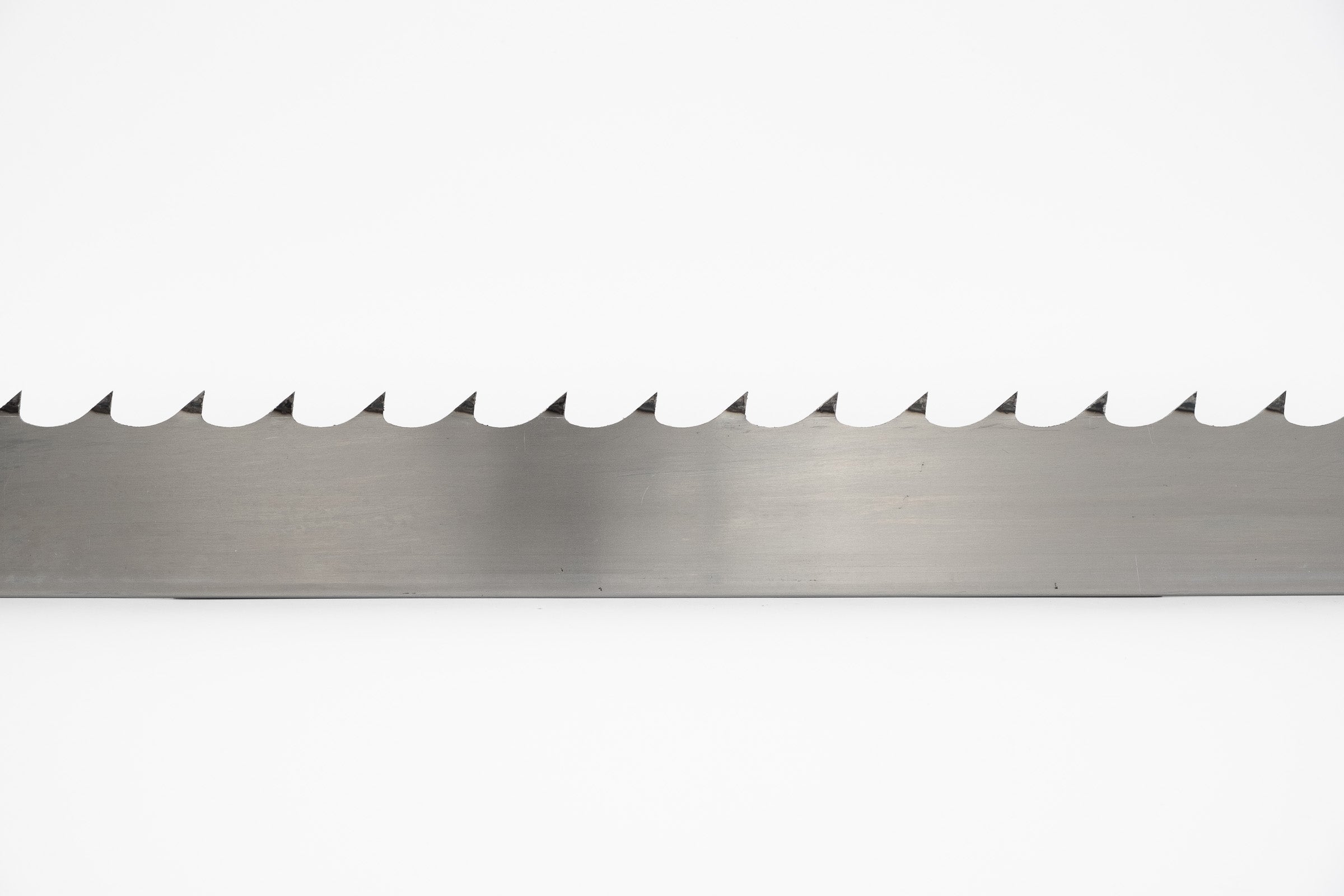 Single sample of 2" wide sawmill blade on a white background.